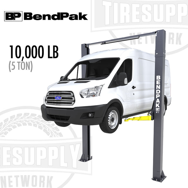A BendPak 2-Post Lift with a 10,000 lb capacity, featuring a white van elevated on the lift, illustrating the clear-floor design.