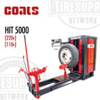 Coats HIT 5000 Heavy Duty Tire Changer with Independent Hook & Roller. The equipment is black and red in color, with a large swing arm, control panel, and a mounted tire on the changer.