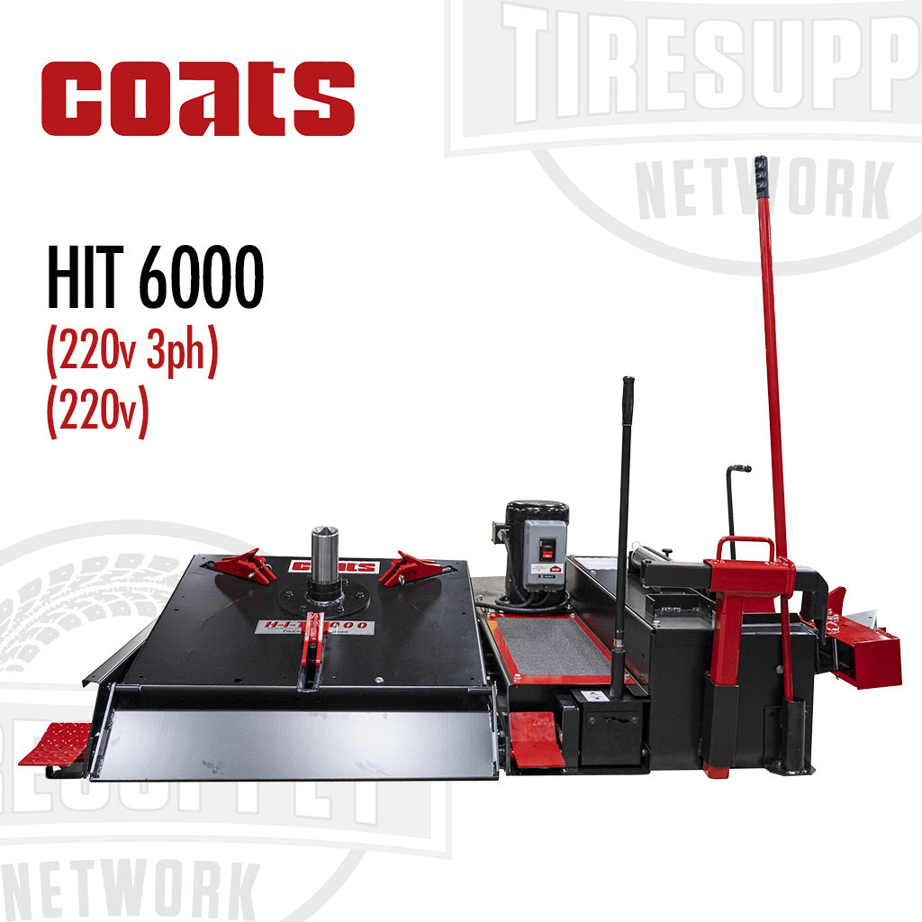 Coats HIT 6000 Heavy Duty Tire Changer with Center Post. The equipment is black and red, with a control stick, adapters, and a table-like structure.