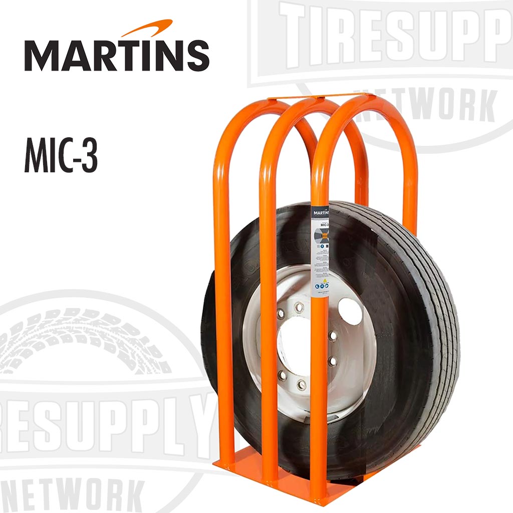 Martins orange steel 3-bar tire inflation cage with a truck tire mounted on it, bearing the Martins Industries logo and model number MIC-3.