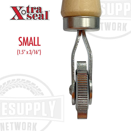 Small metal tool with wooden handle labeled 'Xtra Seal' on a white background. Small 1.5" x 3/16"