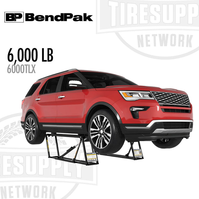 Red SUV on a BendPak tire changer with 'BP BendPak' and 'Tiresup Network' branding. 6000TLX