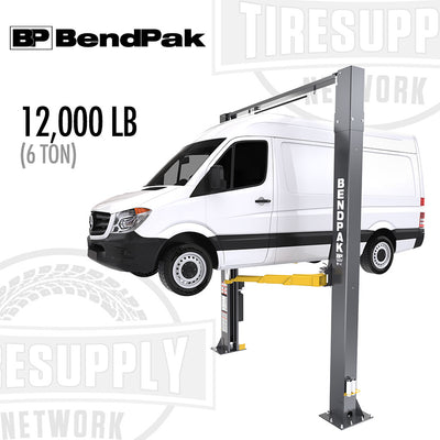 A BendPak 2-Post Lift with a 12,000 lb capacity, clearfloor design, and screw pads. A white van is elevated on the lift, showcasing the lifting capability.