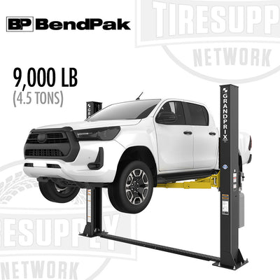 A BendPak 2-Post Lift with a 9,000 lb capacity floorplate, the GrandPrix GP-9LC, in a black color, lifting a white vehicle.
