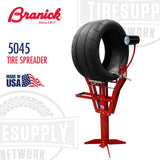The image shows a Branick 5045 Tire Spreader, which is a tool used for tire repair. The tool is red with a black tire mounted on it, and there is a light with a bulb on an adjustable arm for illumination.