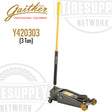 A black and yellow Gaither 3 Ton Turbo Lifter Garage Jack (Y420303) with a handle protector, pump pistons, and wheels for lifting and positioning loads.