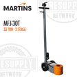 A professional 33-ton 2-stage air/hydraulic floor jack by Martins, with gray body and orange details, including a long handle and wheels for positioning.