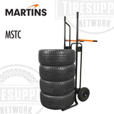 A black and orange Martins Tire Rider Standard Tire Cart (MSTC) with solid rubber wheels and flat-free tires, designed for handling tire/wheel assemblies.