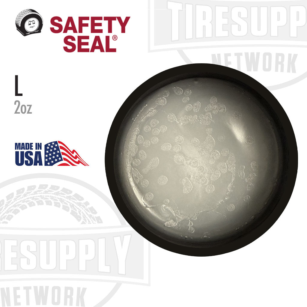 Black container with 'Safety Seal' label on a white background. L