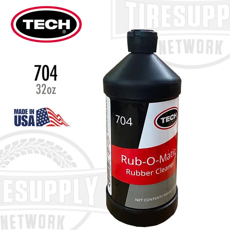 A black bottle labeled TECH Rub-O-Matic Rubber Cleaner with a red and white label, indicating it is a 1-Quart / 32 oz bottle. The product is made in the USA, as stated on the label. 704