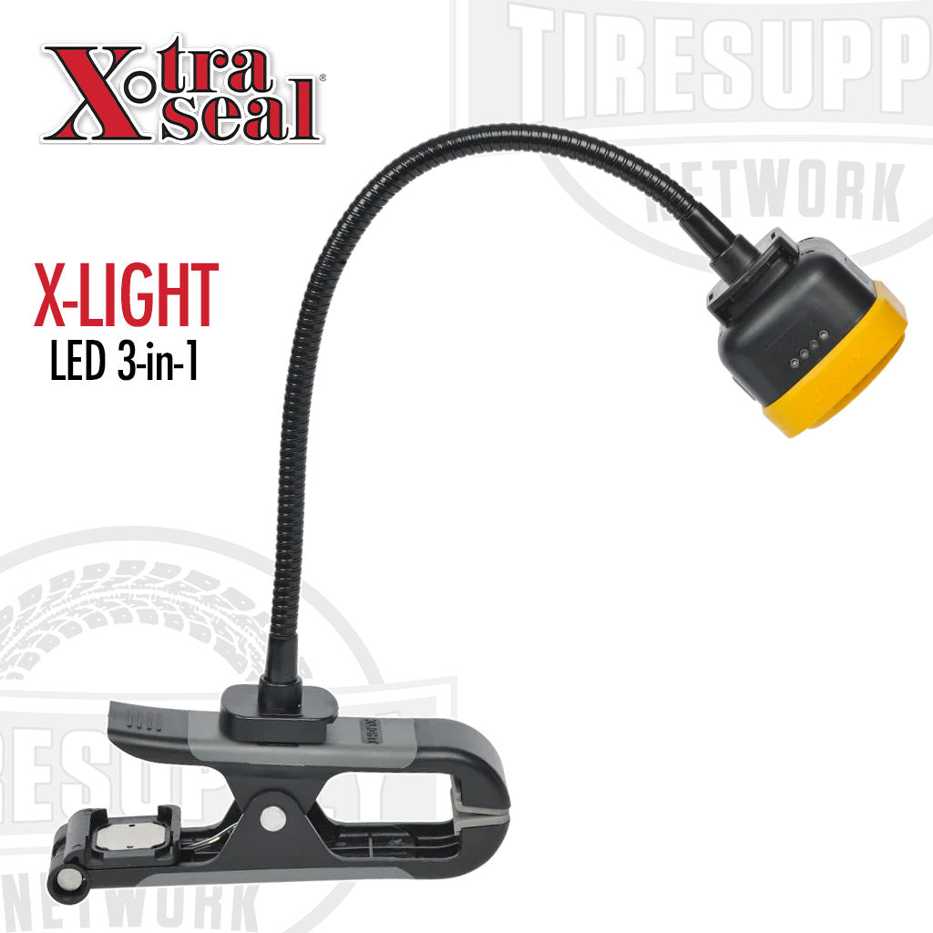 The image shows a black Xtra Seal X-Light LED 3-in-1 tire repair work light with a flexible neck and a clip-on handle, displayed against a white background. 14-923